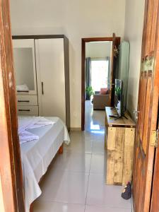 Ένα ή περισσότερα κρεβάτια σε δωμάτιο στο Colibri residencial