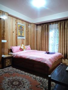Postel nebo postele na pokoji v ubytování Tigerhill Homestay