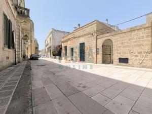 an empty street in an old stone building at Le Cementine Puglia On line in Morciano di Leuca