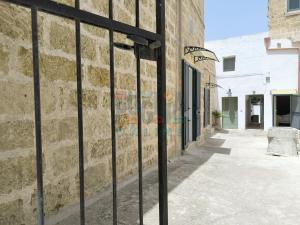 a iron fence in front of a building at Le Cementine Puglia On line in Morciano di Leuca +67 photos