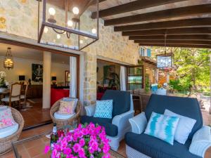 A seating area at Villa La Font by Interhome
