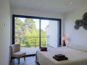 Ένα ή περισσότερα κρεβάτια σε δωμάτιο στο Apartment Les Jardins d'Ève- F3 by Interhome