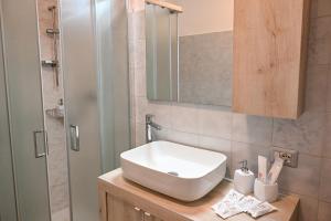 a bathroom with a sink and a shower at Casa Aricò in Calatabiano +20 photos