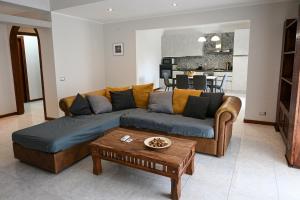 a living room with a couch and a table at Casa Aricò in Calatabiano