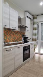 Kuchyň nebo kuchyňský kout v ubytování B&B Suite Penelope