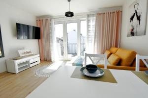 Μια τηλεόραση ή/και κέντρο ψυχαγωγίας στο Apartament Muszelka 27