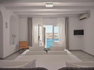 Postel nebo postele na pokoji v ubytování Pietra e Mare - Mykonos Moments