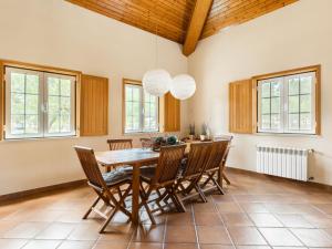 a dining room with a wooden table and chairs at Holiday Home Herdade de Montalvo- Villa 60 by Interhome in Alcácer do Sal +23 photos