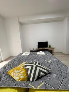 a bedroom with a bed with two pillows on it at Stefanelli Apartment in Struga