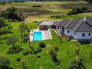 an aerial view of a house with a swimming pool at Holiday Home Countryside estate by Interhome in Križevci +43 photos