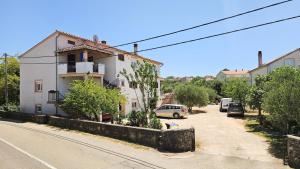 a building on the side of a street at Apartman Petra in Vrh
