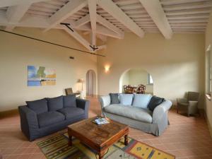 a living room with two couches and a coffee table at Apartment Cipresso by Interhome in Osteria Delle Noci