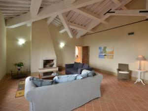 a living room with a couch and a fireplace at Apartment Cipresso by Interhome in Osteria Delle Noci