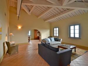a living room with a couch and a table at Apartment Cipresso by Interhome in Osteria Delle Noci