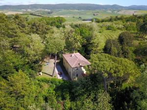 an aerial view of a house in the trees at Holiday Home Pietra by Interhome in Lorenzana