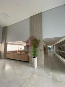 a room with a potted plant in the middle of a building at Spazzio diRoma com acesso ao Acqua Park - Luciana in Caldas Novas