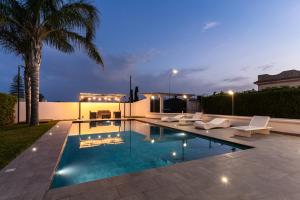a swimming pool in the backyard of a house at Deep Blue Sea in Arenella