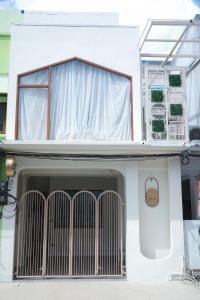 a house with a gate in front of it at Daisy C in Hat Yai