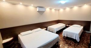 Postel nebo postele na pokoji v ubytování Hotel Bella Vista