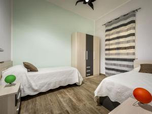 Posteľ alebo postele v izbe v ubytovaní Villa Mari e Monti by Interhome