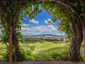 an archway with a view of the rolling hills at Villa La Veduta by Interhome in Molino Mazzetti
