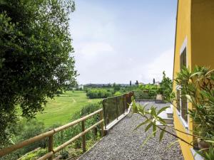 a balcony with a fence and a green field at Holiday Home Il Venturino by Interhome in Fucecchio