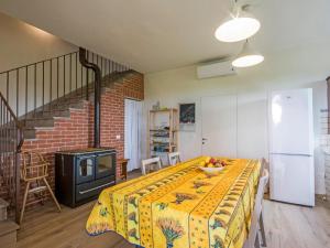a room with a table with a yellow blanket on it at Holiday Home Il Venturino by Interhome in Fucecchio +24 photos