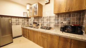 Kuchyň nebo kuchyňský kout v ubytování Walisons Homestay Abelia