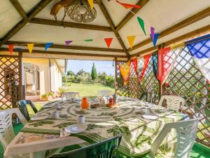 a table and chairs on a patio with flags at Holiday Home Sea View by Interhome in Castelnuovo della Misericordia +51 photos