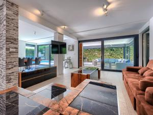 a living room with a couch and a table at Villa Rial 2 by Interhome in Fažana