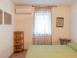 A bed or beds in a room at Villa Rimbaudo by Interhome