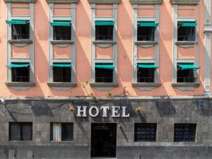 a hotel sign on the side of a building at Hotel Florida, Centro Histórico in Mexico City