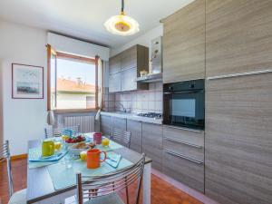 a kitchen with a table with a plate of food on it at Apartment Casa di Neva by Interhome in Marina di Cecina