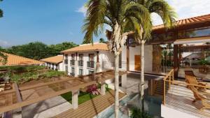 an aerial view of a house with palm trees at Quinta Santa Barbara Cota Resort in Pirenópolis