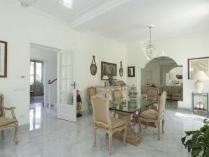 een eetkamer met een tafel en stoelen bij Villa Villa incredible View by Interhome in Mortola Superiore