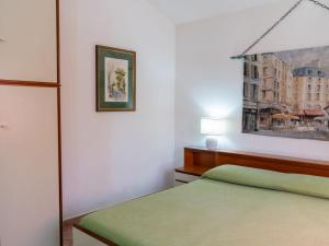 A bed or beds in a room at Villa Rimbaudo by Interhome