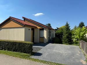 a house with a driveway in front of it at Casa Bep in Zevenhuizen