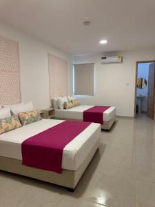Ένα ή περισσότερα κρεβάτια σε δωμάτιο στο Hotel Taybo Kai By St Hoteles +64 φωτογραφίες