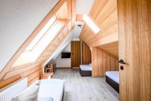 a room with wooden walls and a ceiling with skylights at Willa Stołowianka- Basen in Bukowina Tatrzańska +62 photos