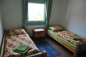 Postel nebo postele na pokoji v ubytování Ferienwohnung Rosenbach OG