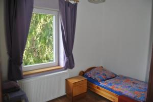 Postel nebo postele na pokoji v ubytování Ferienwohnung Rosenbach OG