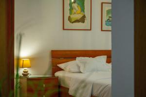 Postel nebo postele na pokoji v ubytování City Center ANA Apartments