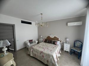 Postel nebo postele na pokoji v ubytování Villa GIOBEA