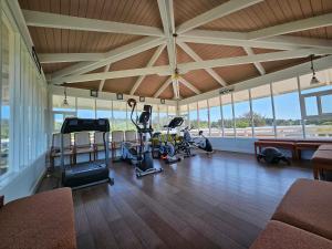 a gym with treadmills and exercise equipment in a building at Beachwood Condos & Resort in Copalis Beach