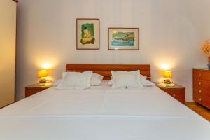Posteľ alebo postele v izbe v ubytovaní City Center ANA Apartments