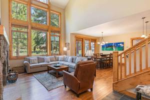 a living room with a couch and a table at Fairway Drive 13151 by East West Hospitality in Truckee