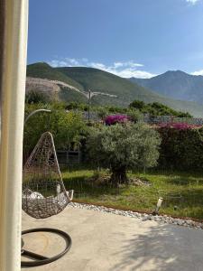 a basket sitting on a patio with mountains in the background at Seanest Greencoast in Himare