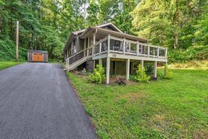 a large house with a porch and a driveway at Pet-Friendly Pickens Vacation Rental with Fire Pit in Sunset