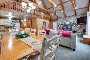 a dining room and living room with a table and chairs at Fire Pit and Community Perks Gouldsboro Cabin! in Gouldsboro