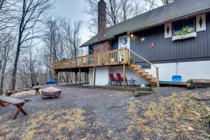 a house with a deck on the side of it at Fire Pit and Community Perks Gouldsboro Cabin! in Gouldsboro